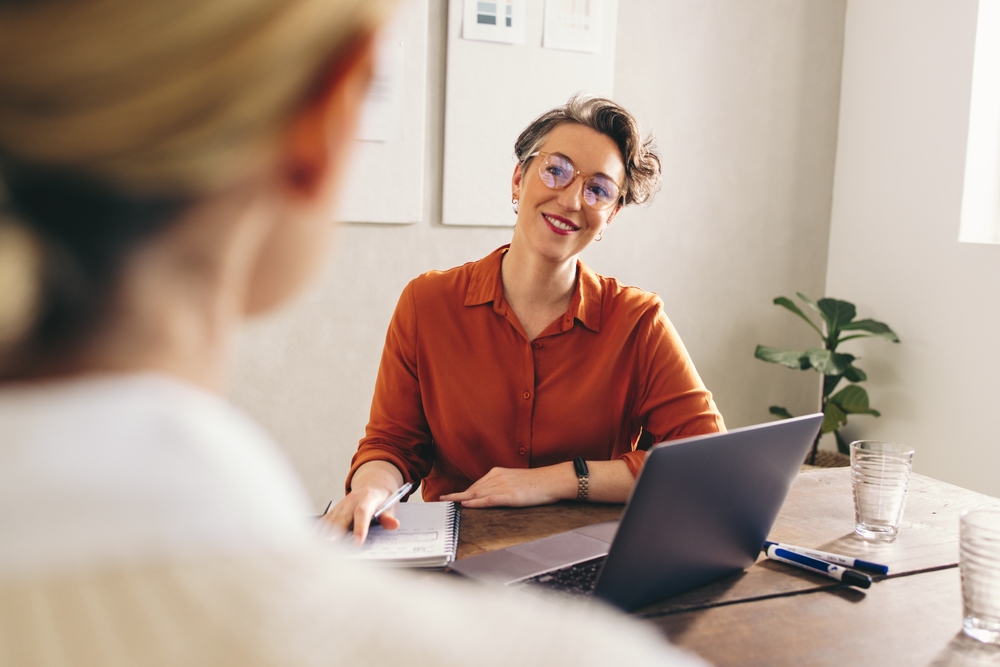 A professional services consultation across a desk